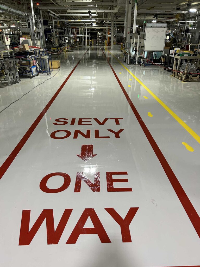 Industrial Epoxy Flooring with One Way Signal Striping